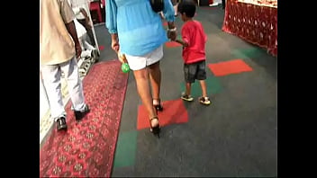Long and painful public walk in stiletto heels at exhibition